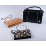 A faux black crocodile handbag and two clutch bags