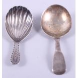 A silver caddy spoon with shell bowl and bright cut handle and a silver Fiddle pattern caddy spoon