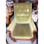 A 19th century armchair with lyre-shaped carved arms, upholstered in a green velour, on turned and