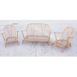 An Ercol spindle back three-piece suite with loose seat cushions