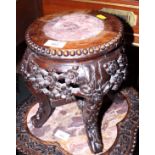 A Chinese carved rosewood vase stand, top inset marble panel, 10" dia