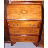 An Edwardian mahogany bureau with shell inlaid flap and three lower drawers, 24" wide