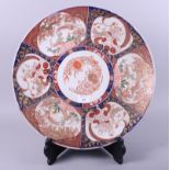 A 19th century Imari porcelain charger, decorated six panels of flowers and birds, 18" dia
