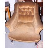 A Victorian armchair with button back, upholstered in a brown velour, on turned supports