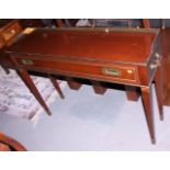 A military design mahogany and brass side table, fitted two frieze drawers and side carrying