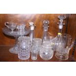 A glass stand together with a pair of decanters, various jars, a jug and other items