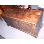 A 17th century oak blanket box, with four-panel front carved lozenges, 56" wide