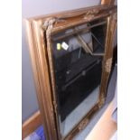 A rectangular bevelled plate wall mirror, in swept gilt frame, 36" x 25" overall, and another