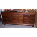 An Oriental hardwood triple chest of nine drawers, 70" wide