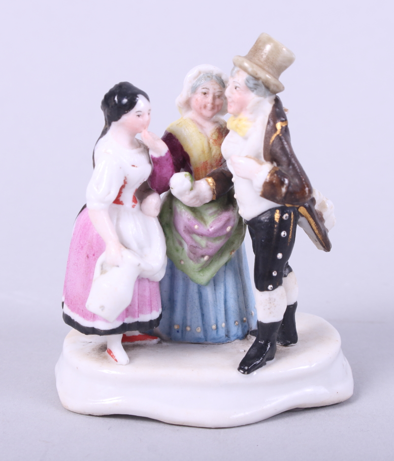 A 19th century Russian porcelain miniature figure group, "Matchmaker", gentleman and two women, 2