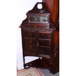 A mid 20th century oak corner desk, fitted nine drawers and a gentleman's mahogany two-door