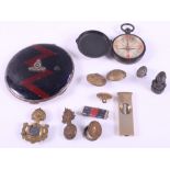 A silver and enamel regimental powder compact, a pocket compass, various military buttons and