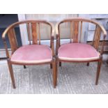 A pair of Edwardian walnut and inlaid tub-shape splat back chairs and a pair of matching side