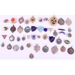 A group of enamelled and other badges, medallions, etc