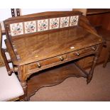 A late Victorian stained wooden dressing table and matching washstand with tiled back