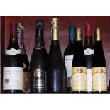 A bottle of Veuve Clicquot 1976 champagne, three other bottles of sparkling wine, a bottle of