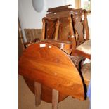 A walnut "D" end dining table with extra leaves, on cabriole supports, and eight walnut and banded