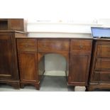 A late 19th century mahogany kneehole sideboard, fitted three drawers over two cupboards, on bracket