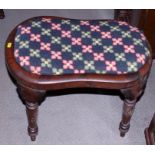 A late 19th century mahogany shaped-seat stool, on turned supports, 23" wide