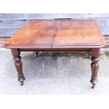 A late 19th century mahogany dining table with two extra leaves, on turned supports, top 93" x 47"