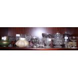Six cut glass sherries, six cut glass wines, a 1920s iridescent glass vase, a similar green vase,