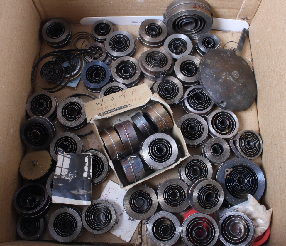 A quantity of clock coil springs, balance wheels and other clock/watch cogs (for restoration - Image 2 of 3