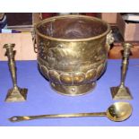 A pair of 19th century brass candlesticks, a ladle and a two-handled coal bucket