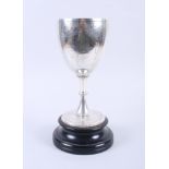 A Victorian silver trophy, 10 1/2" high, on ebonised stand, 14oz troy approx