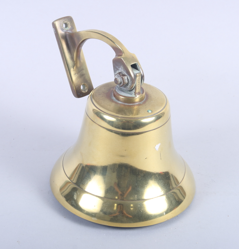 A ship's cast brass bell, on bracket, 6" dia