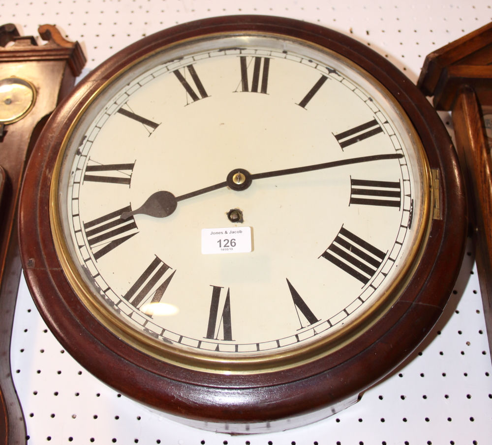 An oak cased "Smiths" eight-day dial clock with Arabic numerals, 14 1/2 dia, and another similar