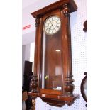 A mahogany cased wall clock with white enamel dial and Arabic numerals