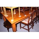 A pine kitchen table, on square shaped supports, 83" x 42", and a set of eight wooden rail back