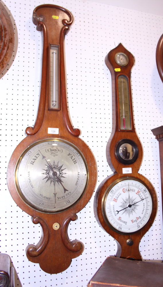 An oak cased barometer and another with a circular central mirror