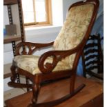 A Victorian mahogany scroll frame rocking chair with drop-in seat, an ash ladder back chair with
