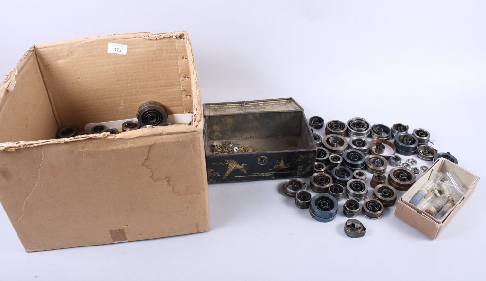 A quantity of clock coil springs, balance wheels and other clock/watch cogs (for restoration