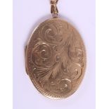 A 9ct gold oval locket with engraved decoration, on a 9ct gold flat curb link necklace, 17.9g gross