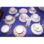 A Chamberlain's Worcester floral and gilt decorated cabinet cup and saucer, two similar cups and