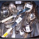 An assortment of silver plated cutlery, including soup spoons, forks, butter knives, etc