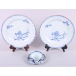 A Nanking porcelain tea bowl and saucer, with labels verso, and a pair of Chinese blue and white