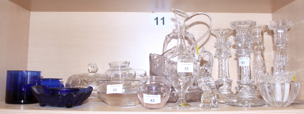 Two opaque twist stem candlesticks and two cut glass candlesticks, two pressed glass baskets and two