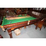 An A W Jelks & Sons "The Challenge" quarter-sized billiard/dining table, complete with cues,