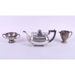A silver teapot, together with a sugar and cream, 31.4oz troy approx