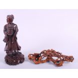 A carved boxwood figure, holding a basket of flowers, 8" high, and a similar carving of cherry