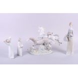 A Lladro group of two galloping horses, 12" high (restored) and a Lladro figure of a girl carrying a
