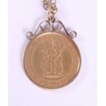 A 1989 gold half sovereign, in 9ct gold mount, on 9ct gold chain, 10.5g gross