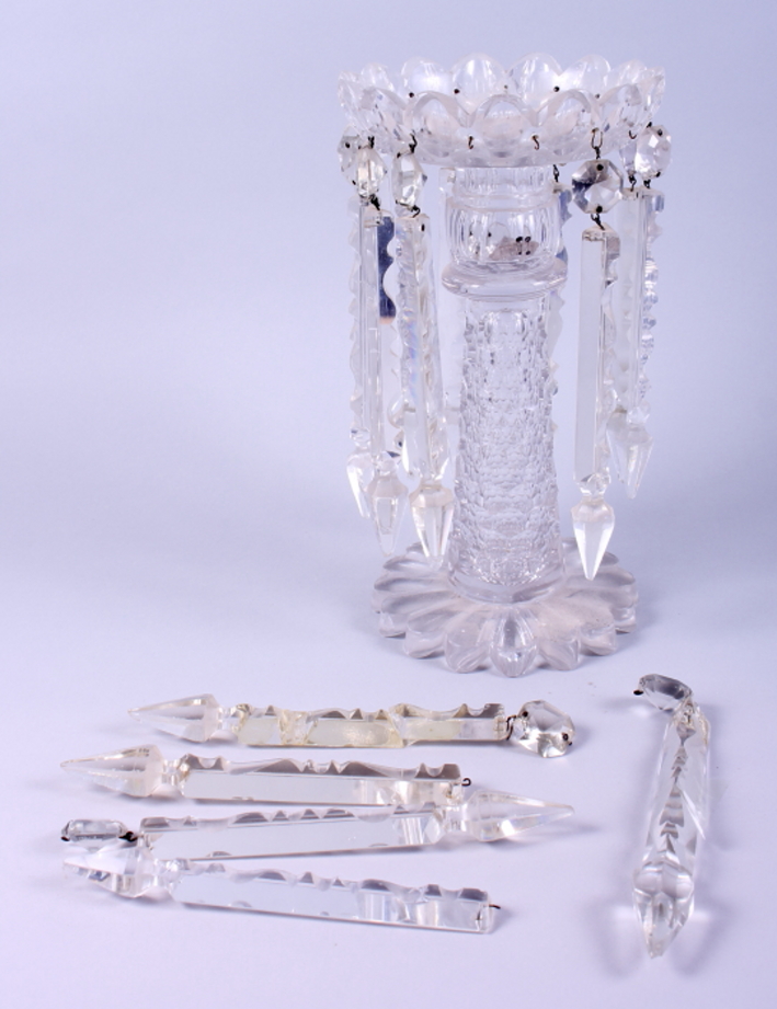 A Victorian glass table lustre hung prism drops