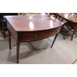 A 19th century mahogany bowfront side table, fitted one deep drawer, on turned supports, 39" wide