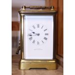 A brass cased carriage clock with striking movement by Castrell South Kensington, 5" high
