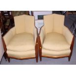 A pair of 1950s "Ruhlmann" style Art Deco octagonal walnut framed armchairs, upholstered in a