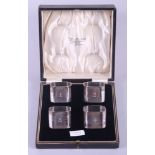 A cased set of four silver napkin rings engraved numerals, 8oz troy approx